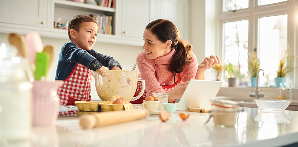 Image: Mom and son baking cookies together